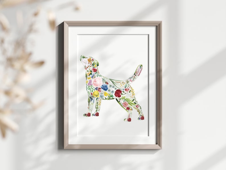 May include: A framed art print featuring a dog silhouette filled with colorful flowers. The floral design includes pink, red, yellow, and blue blooms, set against a white background. The artwork is in a neutral-toned frame.