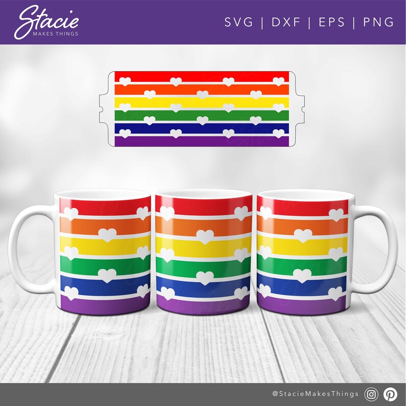 May include: Three white mugs with a rainbow stripe design and white hearts. The stripes are red, orange, yellow, green, blue, indigo, and violet. The mugs are on a white wood surface.
