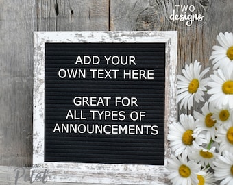 May include: A white framed letter board with a black felt background. The board has the text "ADD YOUR OWN TEXT HERE GREAT FOR ALL TYPES OF ANNOUNCEMENTS". The board is sitting on a wooden surface with a bouquet of white daisies.