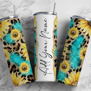 May include: Three stainless steel tumblers with a leopard print and sunflower design. The center tumbler is white with the text "Add Your Name".