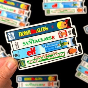 Christmas Movie VHS Stack Sticker - Holiday Movies Christmas Gift - Santa