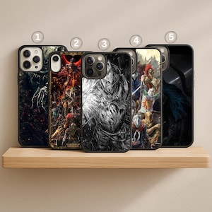 May include: Five black phone cases with various designs are displayed on a wooden shelf. The cases feature detailed graphics, including a skeletal hand, a fiery scene, a knight in grayscale, and a group of figures in armor.