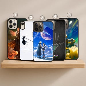 May include: Five phone cases with different designs are displayed on a wooden shelf. The cases feature colorful artwork, including characters and scenes from a video game. The cases have black borders and are designed for a smartphone.
