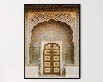 May include: A large, ornate doorway with a golden, intricately carved wooden door. The doorway is decorated with colorful mosaic tiles and a patterned archway.