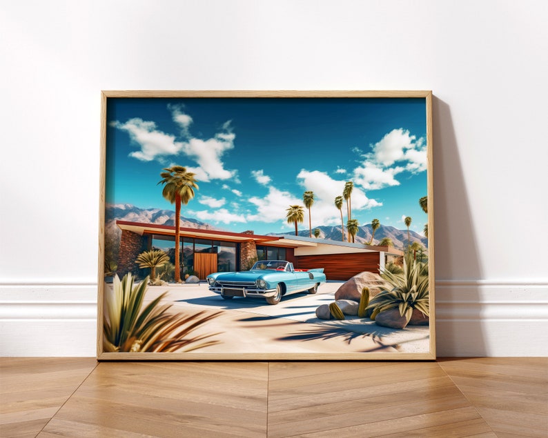 May include: A vintage blue convertible car parked in front of a mid-century modern house with a palm tree lined driveway. The house has a flat roof and large windows. The sky is blue with white clouds.