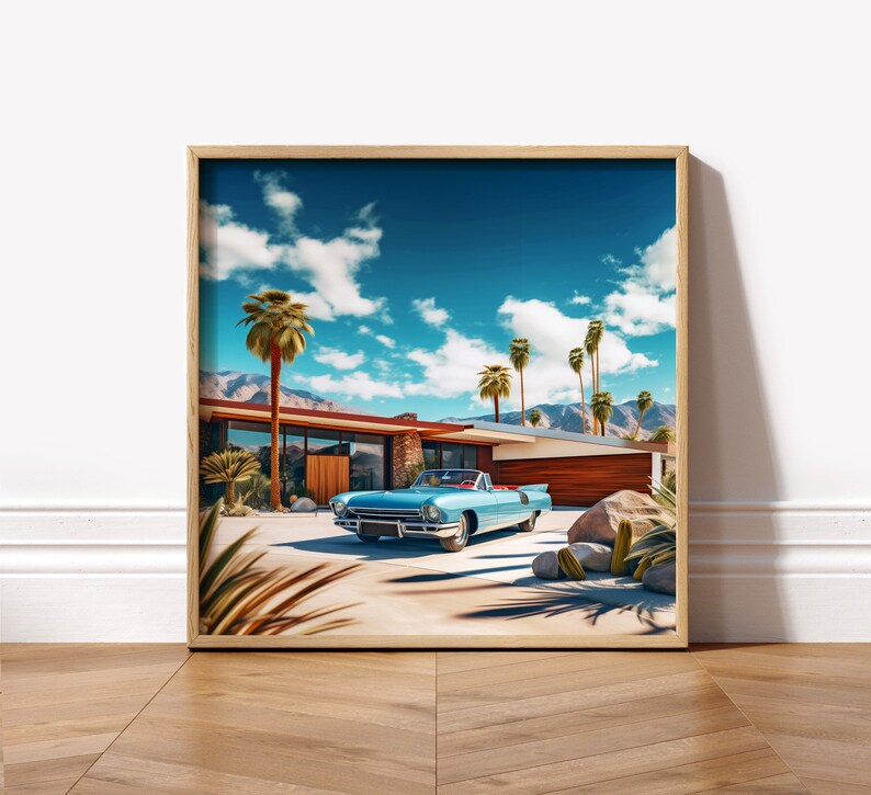 May include: A vintage blue convertible car parked in front of a mid-century modern house with palm trees and a blue sky.