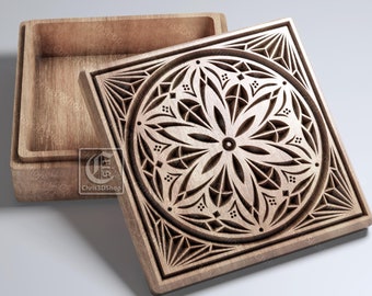 May include: Wooden box with a carved floral design on the lid. The box is open, revealing the interior. The lid features a detailed geometric pattern. The box is made of light-colored wood. The image also includes the text "CNC".