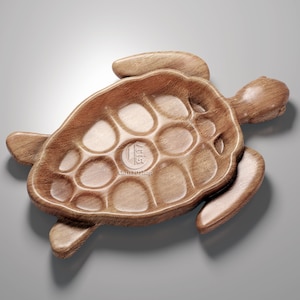 May include: A wooden turtle-shaped serving dish with a carved shell design. The dish is made of natural wood and has a light brown color.