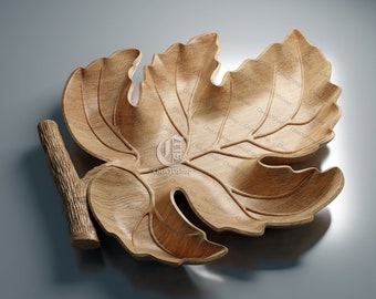 May include: A wooden leaf-shaped serving bowl with a carved stem. The bowl is made of light brown wood and has a natural finish.