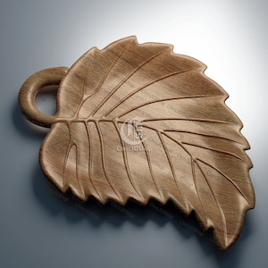 Könnte beinhalten: Eine hölzerne Servierplatte in Blattform mit einem geschnitzten Griff. Die Platte ist aus hellbraunem Holz gefertigt und hat eine natürliche Holzmaserung.