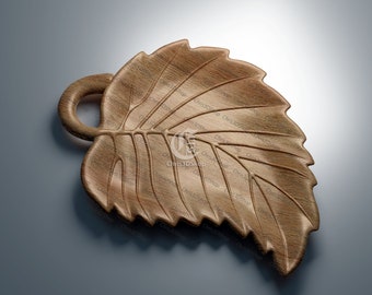 May include: A wooden leaf-shaped serving dish with a carved handle. The dish is made of light brown wood and has a natural wood grain.