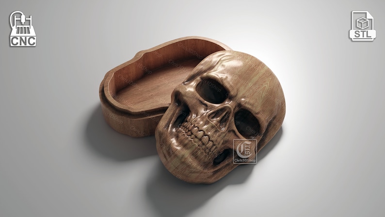May include: A wooden skull-shaped box with a hinged lid. The box is open, revealing the empty interior. The skull is carved with realistic detail, including the teeth and eye sockets.
