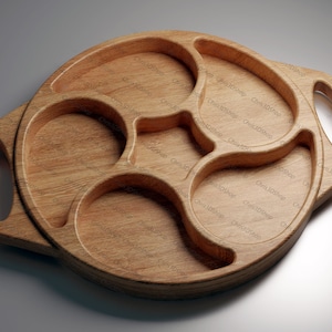 May include: A wooden serving tray with four separate compartments. The tray has two handles on the side and is made of light brown wood.