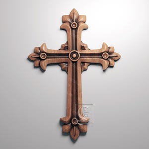 May include: A detailed wooden cross with ornate floral designs. The cross is a warm brown color and features a central circular element and decorative ends. The image includes CNC and STL icons.