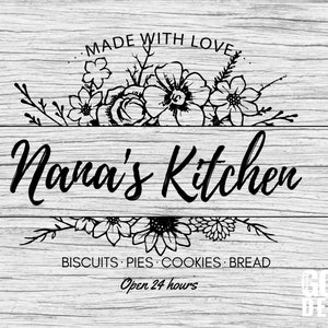 May include: Black and white sign with floral accents that reads "Nana's Kitchen" with the text "Made with Love" above and "Biscuits - Pies - Cookies - Bread" below. The sign also says "Open 24 hours" and "God Bless" at the bottom.