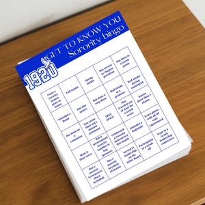 May include: A stack of white bingo cards with a blue header that reads "GET TO KNOW YOU Sorority bingo." The cards feature bingo squares with phrases like "Attended a Boule" and "Has served as chapter president."