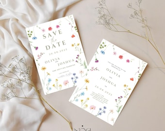 以下が含まれることがあります： 白いウェディング招待状カード2枚。花のボーダー付き。「Save the Date」と「Olivia and Joshua」の文字と20.08.2025の日付が表示されています。カードはカラフルな水彩画の花で飾られています。