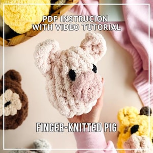 May include: A light pink finger-knitted pig with black eyes and a pink snout. The image includes the text "PDF Instruction with Video Tutorial" and "Finger-Knitted Pig". Other finger-knitted animals are visible in the background.