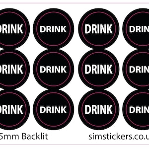 May include: A sheet of twelve circular black stickers, each featuring the white text DRINK in the center surrounded by a thin pink circular border. The sheet includes the text 8.5mm Backlit and simstickers.co.uk printed at the bottom.