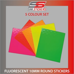 May include: Five sheets of 10mm round fluorescent stickers in pink, orange, yellow, green, and lime green. The sheets are labelled "SIM STICKERS 5 COLOUR SET".