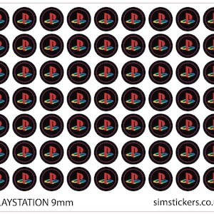 May include: Sheet of 9mm PlayStation logo stickers. Each sticker features the iconic PlayStation symbol in red, blue, and yellow on a black background. The text "PLAYSTATION 9mm" is printed at the bottom.