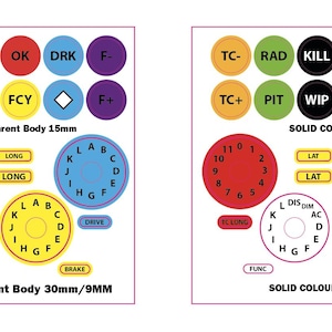 Puede incluir: Dos hojas de pegatinas circulares de colores con varias etiquetas y texto. La fila superior incluye etiquetas como "TC-", "RAD" y "KILL". La fila inferior presenta diales y el texto "B&W Text Transparent Body 30mm/9MM" y "SOLID COLOUR 30mm/9MM".