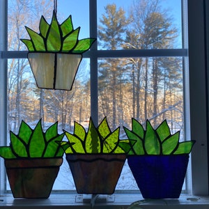 Stained glass, cute, potted succulents. Great colors, custom colors