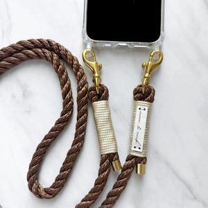 Brown mobile phone chain mobile phone cord interchangeable strap with gold carabiner and mobile phone case with eyelets