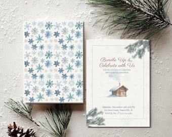 May include: Winter-themed invitation set. One card features a snowflake pattern in blue and beige. The other card has the text "Bundle Up & Celebrate with Us" with a cabin illustration and event details. Pine branches and a pinecone are in the image.