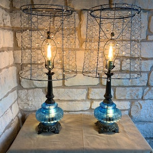 Set of 2 Vintage MCM (1974) Hollywood Regency Bronze and blue glass lamps, rewired, with custom geometric wire and salvaged crystals shade