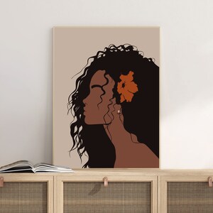 May include: A digital illustration of a woman with long, curly brown hair and a single orange flower behind her ear. The background is a light beige color.