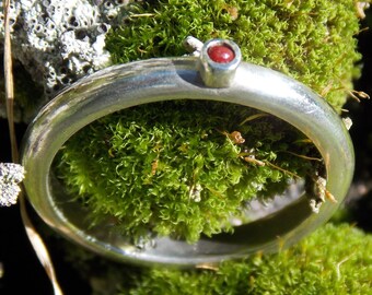 Silver ring, narrow, with small red glass bead