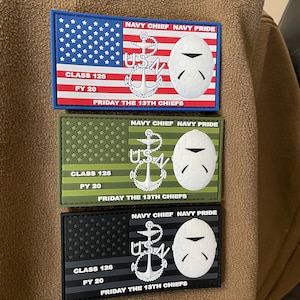 May include: Three embroidered patches with a US Navy theme. Each patch features a US flag, an anchor, and a hockey mask. The text on the patches reads "NAVY CHIEF NAVY PRIDE", "CLASS 126 FY 20", and "FRIDAY THE 13TH CHIEFS".