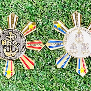 May include: Gold-colored, star-shaped medal with a blue, red, and gold design. The medal features the text "NAVY CHIEF ASK THE CHIEF NAVY PRIDE" and "KEEP CALM AND ASK THE CHIEF".