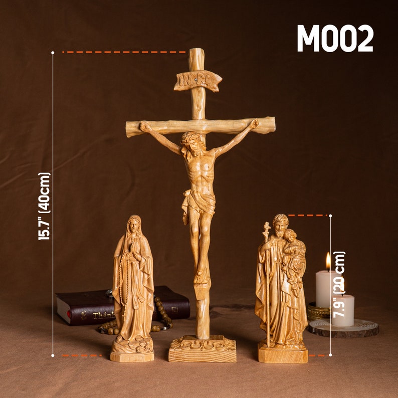 May include: A wooden crucifix with a carved figure of Jesus Christ, a wooden statue of the Virgin Mary, and a wooden statue of Saint Joseph with the baby Jesus. The crucifix is 15.7 inches tall and the statues are 7.9 inches tall.
