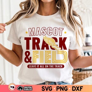 May include: White t-shirt with the words "MASCOT TRACK & FIELD" in maroon and gold. The design includes a winged track shoe graphic and the phrase "LEAVE IT ALL ON THE TRACK". The shirt is a casual wear item.