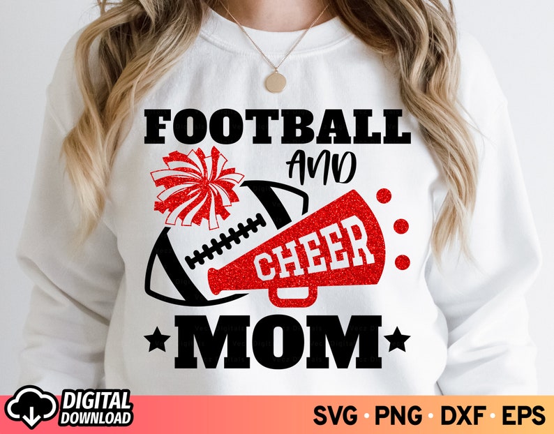 May include: White sweatshirt with a black and red graphic. The graphic includes a football, a red megaphone with the word "CHEER", and the words "FOOTBALL AND MOM". A red and white pom-pom is also included.