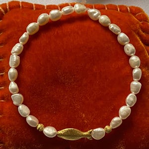 Handmade freshwater pearl bracelet with sterling silver fish gold plated