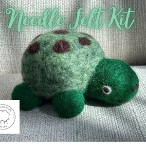 May include: Needle felting kit to make a green turtle with brown spots. The kit includes all the materials needed to create a cute and cuddly turtle.