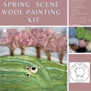 May include: A wool painting kit with the text "SPRING SCENE WOOL PAINTING KIT". The kit includes wool and silk, a 20cm x 20cm wool felt, two barbed felting needles, a foam pad, and instructions. The image shows a felted landscape with pink trees and a green hill.