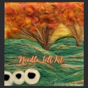 May include: A needle felt kit depicting a landscape with trees and a creature. The trees have orange and yellow leaves, and the creature has three white eyes with black pupils. The text "Needle Felt Kit" is written in a cursive font.