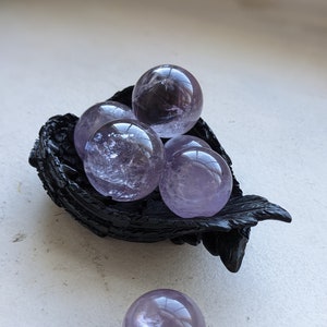 Clear amethyst crystal sphere - pale purple balls with rainbows