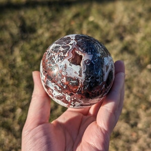 Mexico lace agate sphere with druzy and red patches - 69 mm diameter