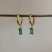 Gold plated huggie hoop earrings, emerald coloured pendant