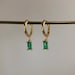 Gold plated huggie hoop earrings, emerald coloured pendant 