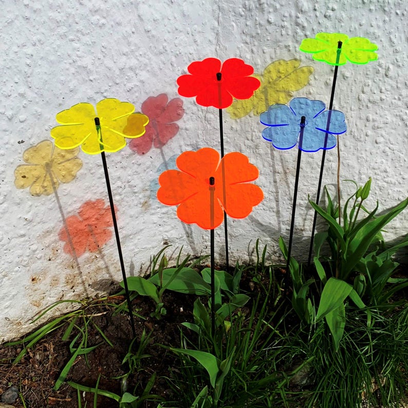 Set of 5 Double Blossom, 5 colour choice, 75cm, 29.5 inch  high, 15cm, 5.9 inch diameter. SunCatchers work without battery, drawing natural UV light, emitting glow at edges. Glowing dawn to dusk. Image shows 5 green Double Blossoms