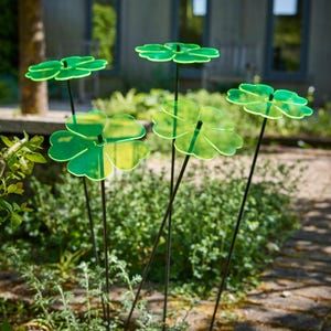 Set of 5 Double Blossom, 5 colour choice, 75cm, 29.5 inch  high, 15cm, 5.9 inch diameter. SunCatchers work without battery, drawing natural UV light, emitting glow at edges. Glowing dawn to dusk. Image shows 5 red Double Blossoms