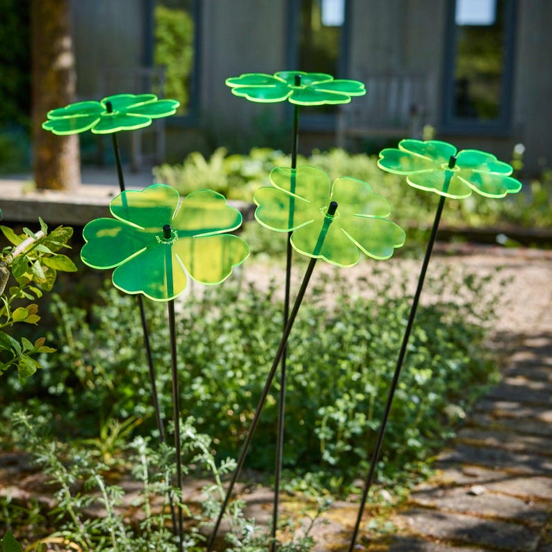 Set of 5 Double Blossom, 5 colour choice, 75cm, 29.5 inch  high, 15cm, 5.9 inch diameter. SunCatchers work without battery, drawing natural UV light, emitting glow at edges. Glowing dawn to dusk. Image shows 5 red Double Blossoms