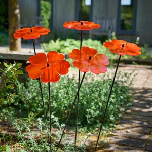 Set of 5 Double Blossom, 5 colour choice, 75cm, 29.5 inch  high, 15cm, 5.9 inch diameter. SunCatchers work without battery, drawing natural UV light, emitting glow at edges. Glowing dawn to dusk. Image shows 5 orange Double Blossoms