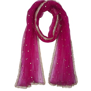 May include: A pink sheer dupatta with gold trim and sequins. The dupatta is a traditional Indian garment worn as a scarf or shawl.